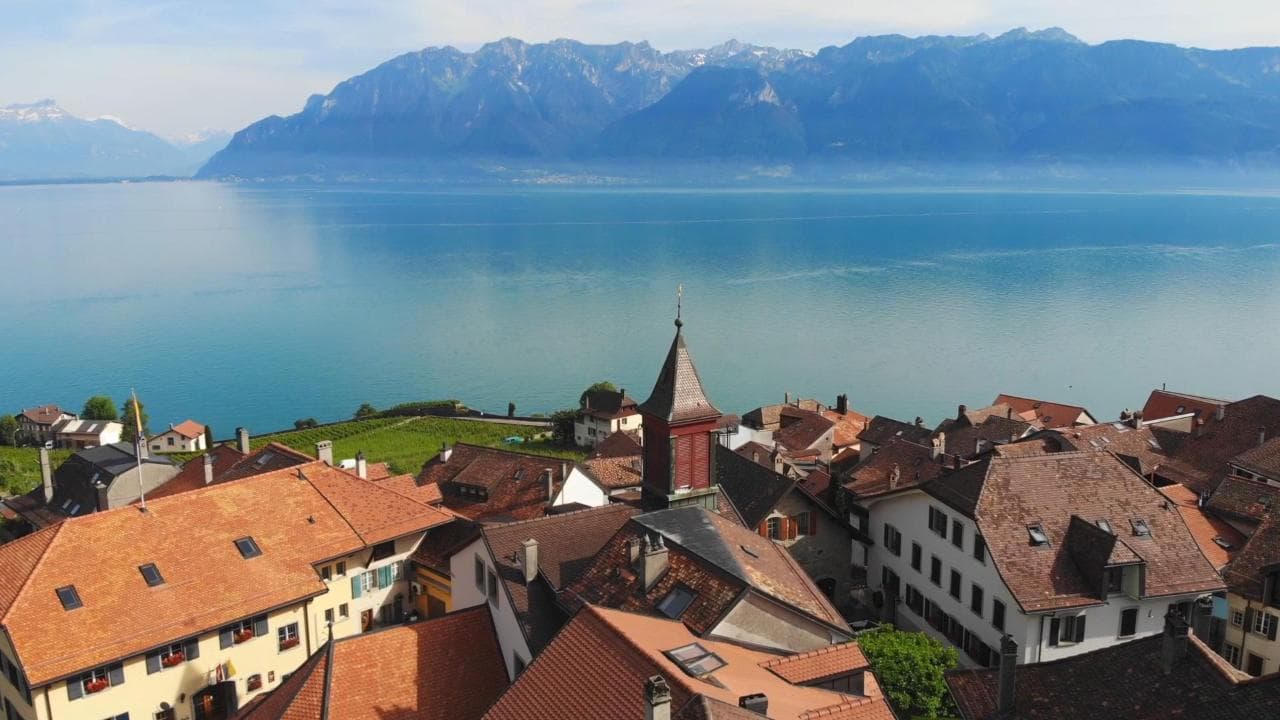 Lake Léman and the Alps above a lakeside village